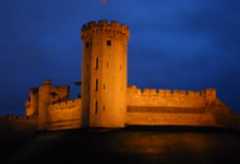 Warwick Castle lit up at night